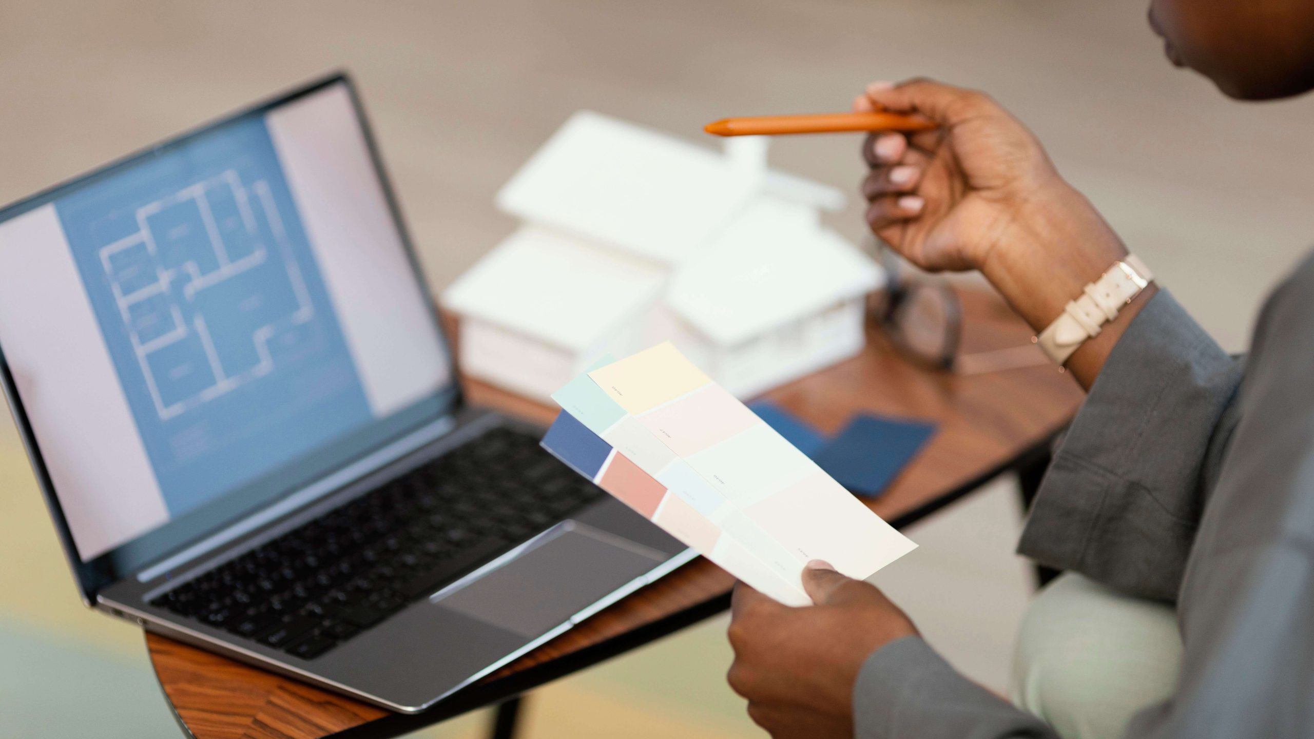 side-view-woman-making-plans-redecorate-home-with-laptop (1)